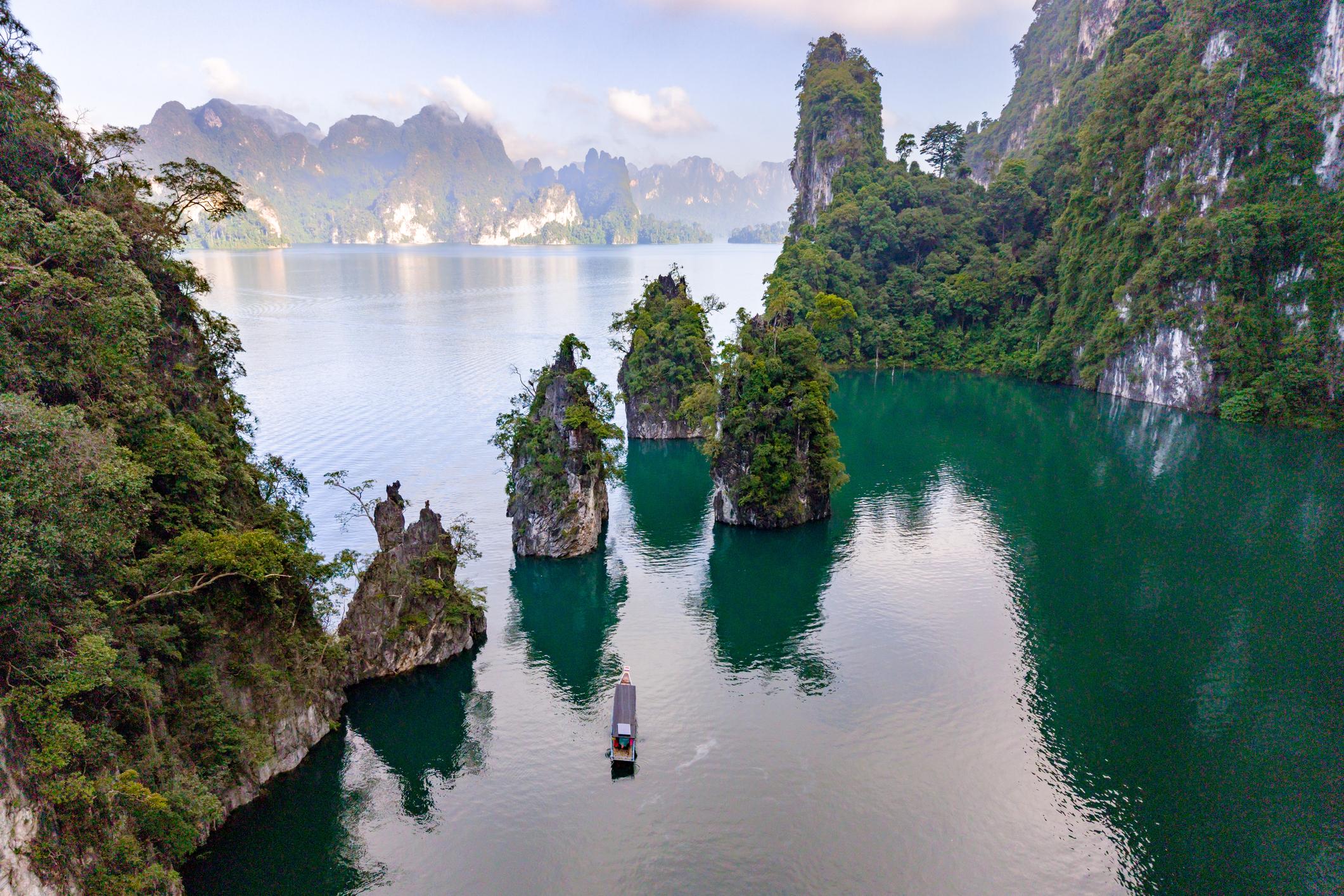 Explore the serene beauty of Khao Sok with stunning limestone formations in Thailand